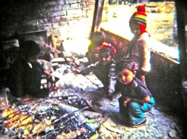 15-Children_around_fireplace
